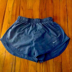 Nike kids small shorts that are a light navy blue